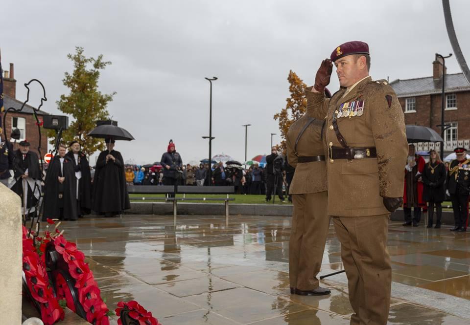 Service personnel laying their wreaths