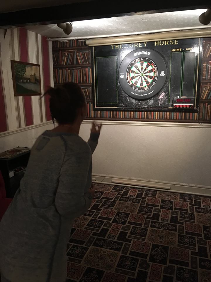 Trying to hit the dart board and not the wall