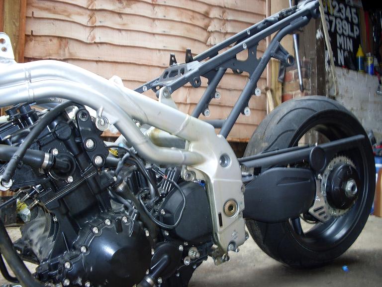 Speed Triple swingarm and shock assembly, wheel and brake disk, sprocket and hub assembly